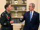President George Bush with General Petaeus (Photo : Reuters)