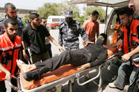 A Palestinian militant wounded during an IDF air strike(Photo : Reuters)