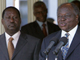  Mwai Kibaki, with Raila Odinga, announces the formation of the government on Sunday   (Photo: Reuters)