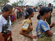 Cyclone survivors queue up to receive relief goods(Photo: AFP)