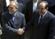 Nuri al-Maliki (R) shakes hands with Iran's Vice President Parviz Davoudi(Photo: Reuters)