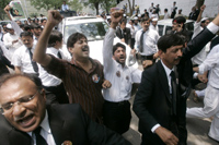 Lawyers chant as Chaudhry a leaves his residence in Islamabad (Photo: Reuters)