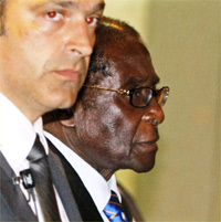 Robert Mugabe, with bodyguard, in Rome for the world food summit(Photo: Reuters)