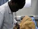 A doctor attends to a HIV/AIDS patient at Uganda's Infectious Disease Institute in Kampala (Photo : Reuters)