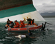 Philippine coast guard divers retrieve a body from the capsized ferry(Photo: Reuters)