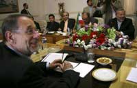 EU foreign policy chief Javier Solana with Iranian Foreign Minister Manouchehr Mottaki in Tehran.(Credit: Reuters)