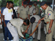 Railway police check the bag of a passenger, after Bangalore's serial bomb blasts, at Allahabad railway station 25 July 2008. Seven small bombs exploded in quick succession across the south Indian IT city of Bangalore on Friday, killing a woman and wounding at least 15 people, police said. REUTERS/Jitendra Prakash (Photo: Reuters)