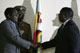 Zimbabwe's President Robert Mugabe (l) shakes hands with opposition leader Morgan Tsvangirai(Credit: Reuters)