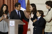 The family of Ingrid Betancourt with President Sarkozy speaking after the news of Betancourt's freedomPhoto: Reuters