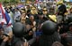 Thai riot police try to stop Thai nationalist protesters(Credit: Reuters)