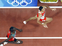 Rashid Ramzi of Bahrain (R) celebrates at the finish line ahead of Asbel Kipruto Kiprop of Kenya.(Photo: Reuters)