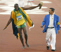 Double gold medalist Usain Bolt celebrates after breaking the world record in the 200m.(Photo: Reuters)