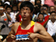 Liu Xiang of China grimaces in pain after he pulled up in the 110 metre high hurdles.(Photo: Reuters)