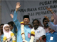 Anwar Ibrahim and his wife and supporters wave to the crowd.(Photo: Reuters)