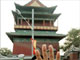 A Chinese police officer attempts to block the camera at the Drum tower.(Photo: AFP)