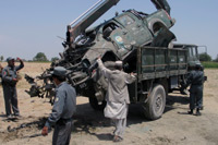 A destroyed police vehicle is put on a truck after a bomb blast in Nangarhar province(Photo: Reuters)