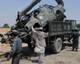 A destroyed police vehicle is loaded onto a truck after a road side bomb blast in the eastern Nangarhar province(Photo: Reuters)