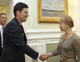 Ukraine's Prime Minister Yulia Tymoshenko (R) shakes hands with Britain's Foreign Secretary David Miliband in Kiev(Photo: Reuters)