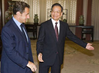 France's President Nicolas Sarkozy (L) meets with Chinese Premier Wen Jiabao in Beijing(Photo: Reuters)