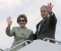 President George Bush and his wife before they left for Asia.(Photo : Reuters)