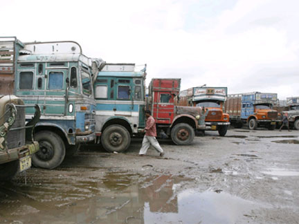 A truck driver walks past parked trucks during a nationwide strike in the Indian city of Siliguri(Photo: Reuters)