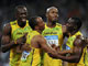 (From L to R) Usain Bolt of Jamaica celebrates with his teammates Michael Frater, Asafa Powell and Nesta Carter.