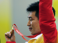 Pang Wei of China with the men's shooting gold.(Photo: Reuters)