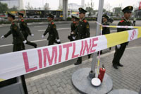 Chinese police patrol streets outside the stadium(Credit: Reuters)