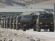 Russian military vehicles leave from a Georgian military base while departing Gori.(Photo: Reuters)