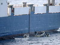 Pirates board the Ukranian ship Faina.(Photo: Reuters)