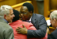Kgalema Motlanthe (C) greets members of parliament(Photo: Reuters)