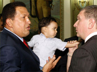 Chavez,  with his grandson Jorge, greets Russia's Deputy Prime Minister Igor Sechin in Caracas last week(Photo: Reuters/Miraflores Palace/Handout)