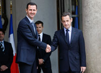 Nicolas Sarkozy greets Bashir al-Assad at the Elysee during his visit to Paris in July.(Photo : Reuters)