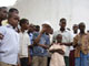Residents stand near the body of a civilian killed in Mogadishu(Credit: Reuters)