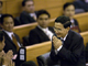 Somchai Wongsawat greets members after arriving in Parliament (Photo: Reuters)