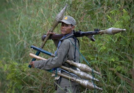 A Cambodian soldier with rockets on patrol in the disputed border region.(Photo: Reuters)