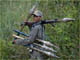 A Cambodian soldier with rockets on patrol in the disputed border region.(Photo: Reuters)