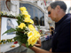 A relative places flowers at the memorial to the victims of the Bali bombings.(Photo: Reuters)
