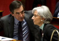 France's Prime Minister Francois Fillon (L) and Economy Minister Christine Lagarde consult during the National Assembly debate on teh bank rescue plan.(Photo: Reuters)