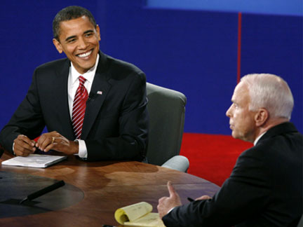 Obama answers a question while McCain watches(Photo: Reuters)