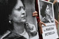 Portraits of Petrella at a support rally in Paris in June(Photo: AFP)