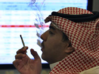 A trader looks at trading board at a Saudi Bank in Riyadh(Photo: Reuters)