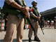 Thai navy soldiers stand in front of a police checkpoint at Suvarnabhumi Airport, 29 November 2008(Photo: Reuters)