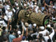 The body of Bali bomber Imam Samudra is carried out of a mosque after prayers, before the funeral in Serang, Indonesia's Banten province November 9, 2008.