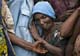 A woman leans on a family member in Rutshuru(Credit: Reuters)