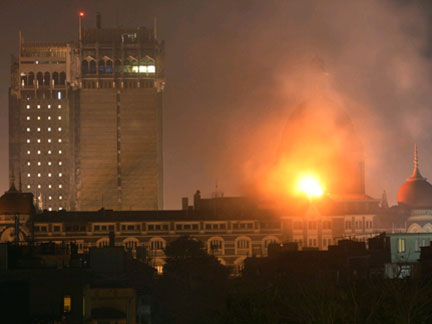Smoke and fire billows out of the Taj Hotel in Mumbai overnight(Photo: Reuters)