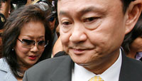 Thaksin Shinawatra and his wife Potjaman, 31 July 2008.(Photo : Reuters)