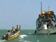 Pirates on speedboat approach one of their mother boats docked near Eyl, Somalia.(Photo: Reuters)