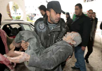 A wounded Palestinian is carried to al-Shifa hospital after an Israeli air strike(Photo: Reuters)