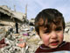 A boy in front of his family's house in Jabalya, northern Gaza, 19 January 2009(Photo: Reuters)